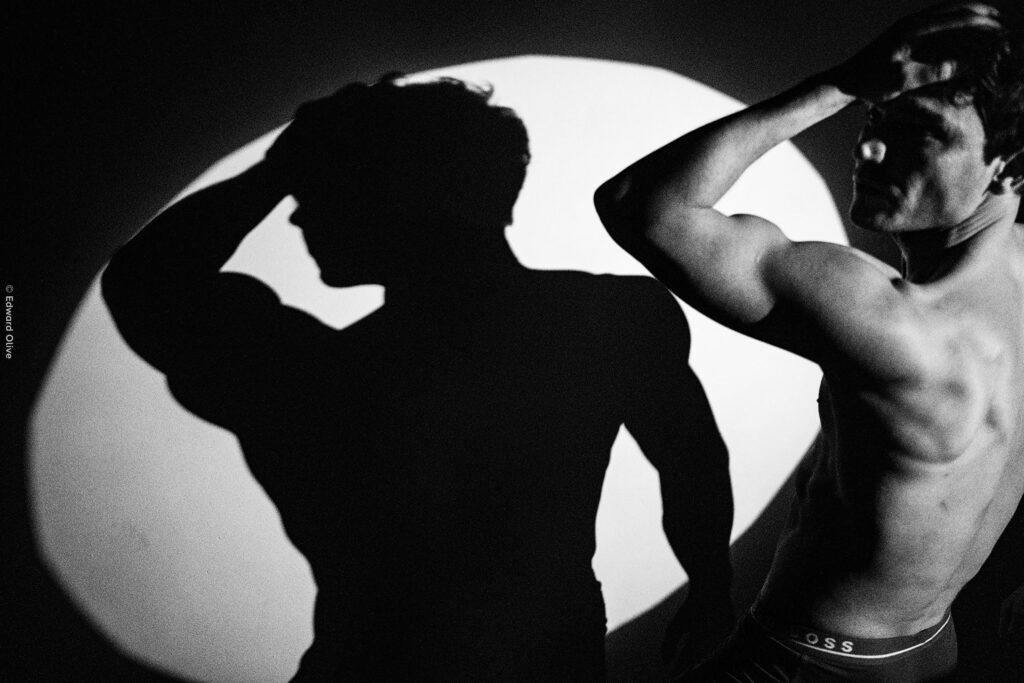 Edward Olive Male model and shadow in spotlight